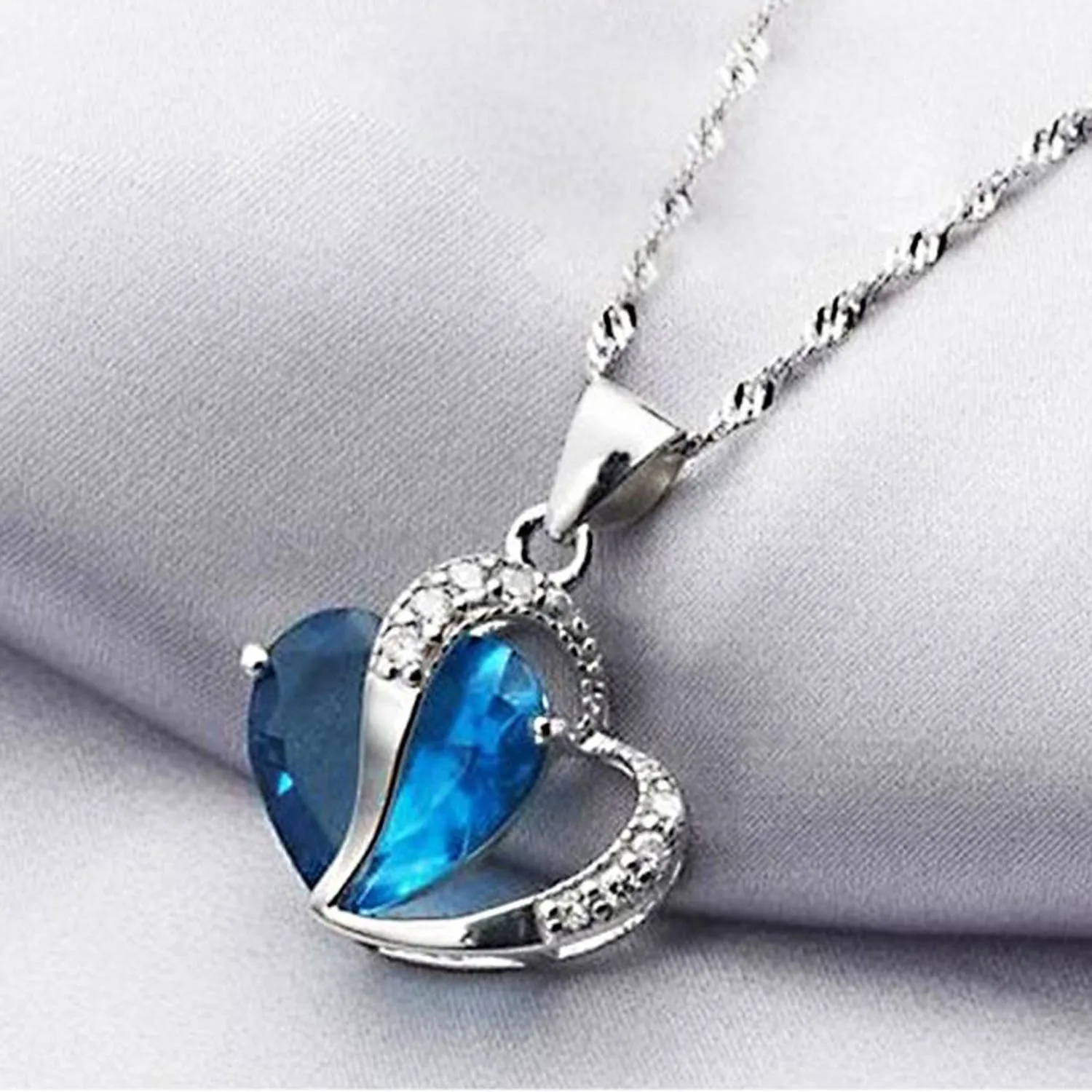 Scintillare by Sukkhi Trendy Joint Valentine Heart Crystals from Swarovski Rhodium Plated Pendant for Women