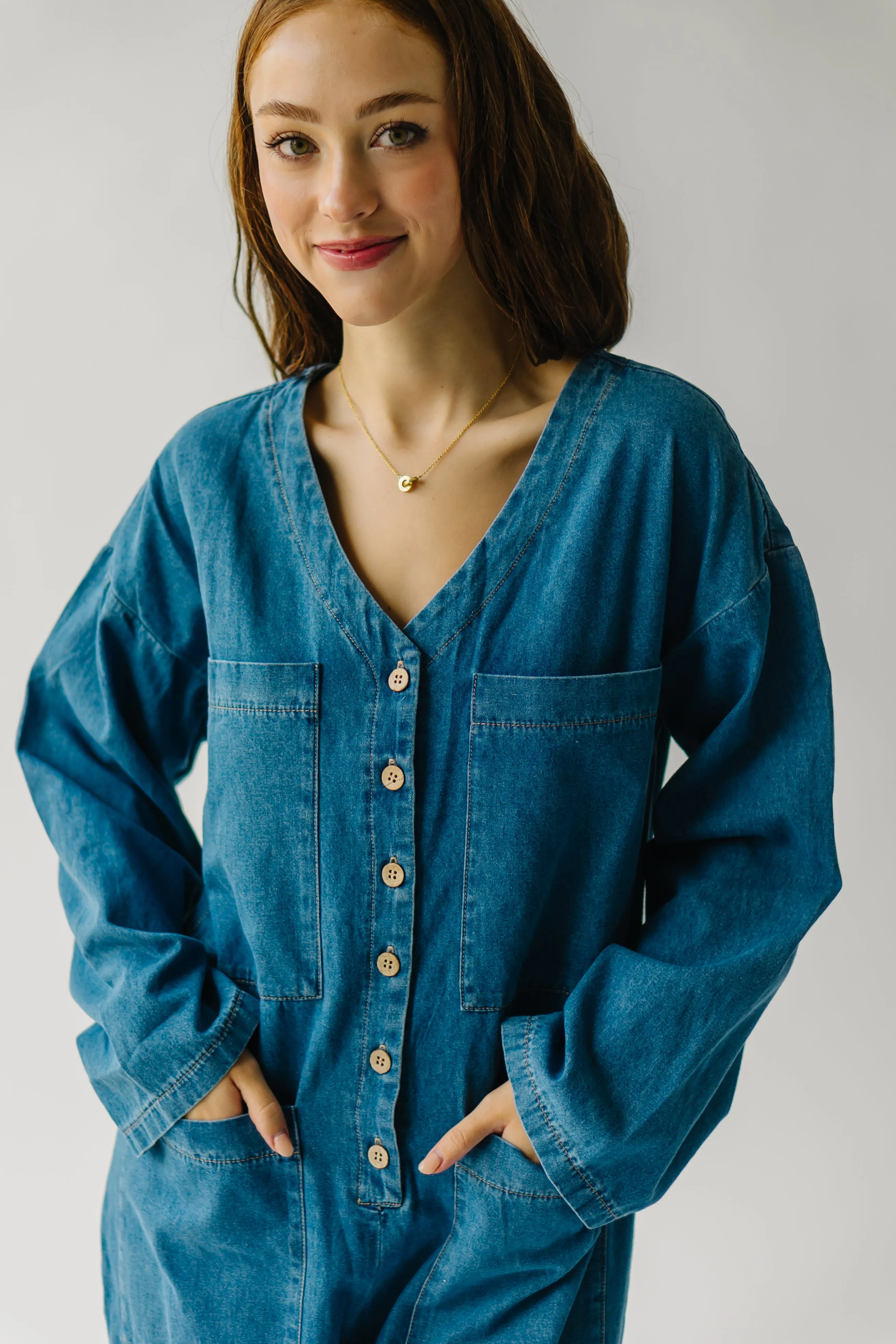 The Adeline Button-Down Jumpsuit in Washed Denim